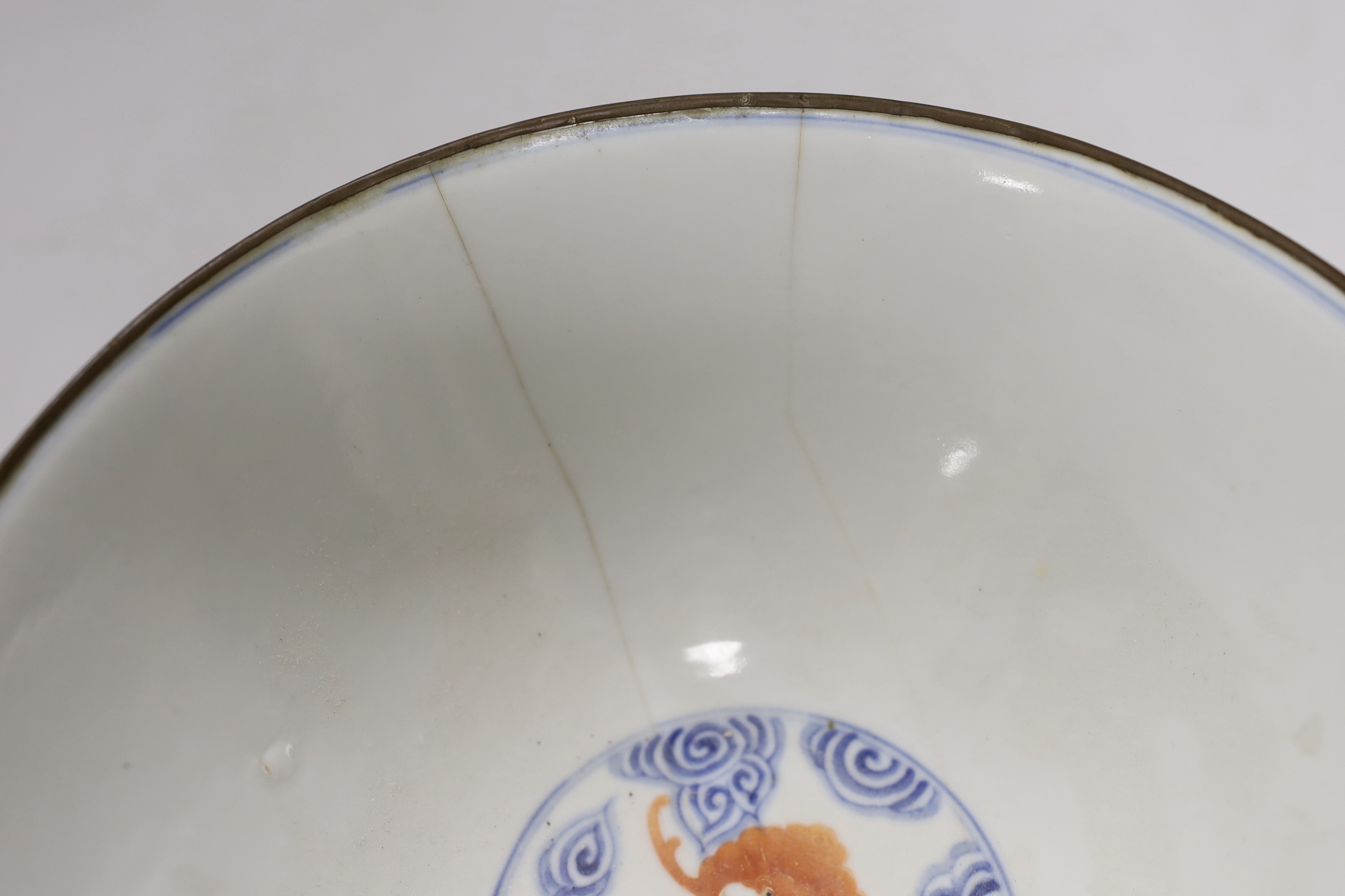 A 19th century Chinese blue and white bowl with iron-red bats, 23cm diam.